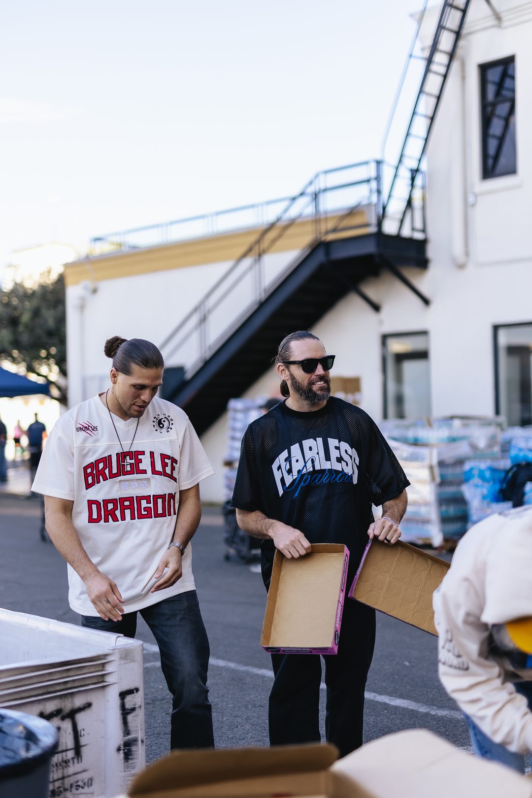 Love More team carrying boxes